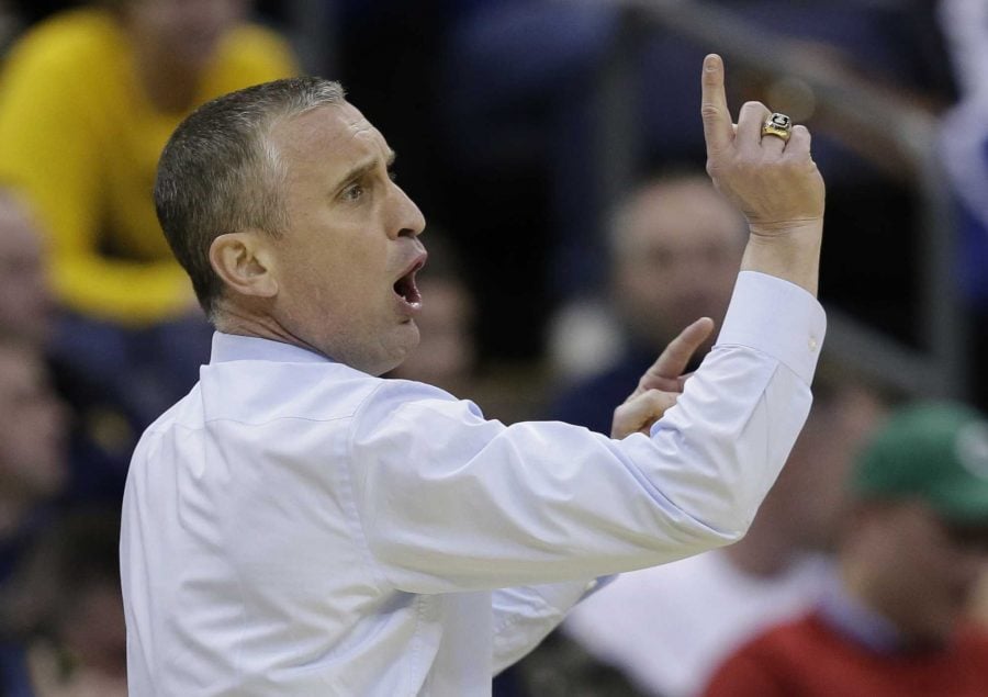 This March 20, 2015, file photo shows Buffalo head coach Bobby Hurley signaling to his team during the first half of an NCAA tournament college basketball game against West Virginia in Columbus, Ohio. (AP Photo/Tony Dejak, File)
