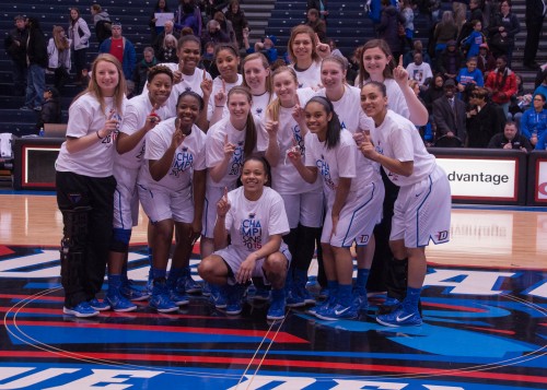 DePaul women's basketball poses at half-court following their 99-82 win Sunday  for clinching their second consecutive regular season Big East title. (Maggie Gallagher/ The DePaulia)