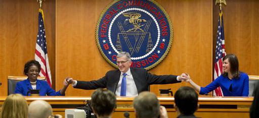 Mignon Clyburn (left), Tom Wheeler and Jessica Rosenworcel of the Federal Communication Commission pose after the legal hearing on Internet practices. (AP Photo/Pablo Martinez Monsivais)