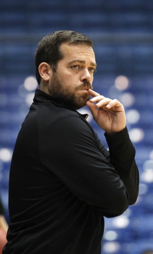 Manhattan head coach Steve Masiello watches his team during practice for an NCAA college basketball first round game Monday, March 16, 2015, in Dayton, Ohio. Manhattan plays Hampton in Dayton on Tuesday. (AP Photo/Skip Peterson)