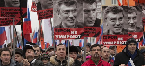 People march in support of Boris Nemtsov, a vocal critic of President Vladimir Putin who was recently killed. Some suspect political motivation behind Nemtsov's killing. (PAVEL GOLOVKIN | AP)