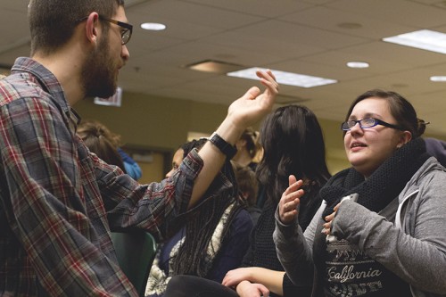 Senior JP Matz (L) and junior Jasmine Preciado engage in dialogue about social justice and poverty. (Megan Deppen / The DePaulia)