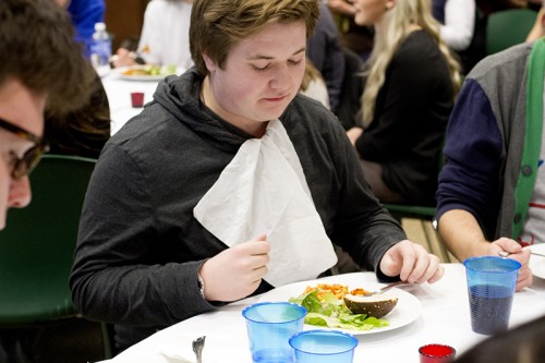 Freshman Sean Esterquest was on of the few served dinner at the upper-class table. (Megan Deppen / The DePaulia)