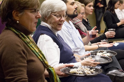 Director of Catholic Campus Ministry Sr. Katie Norris ate a modest plate of rice and beans as speakers from the Chicago Coalition for the Homeless told stories of homelessness and food insecurity. (Megan Deppen / The DePaulia)