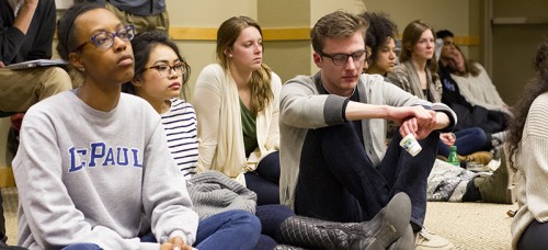 Students Gabrielle Berry (L) and Murray Campbell (R) were silent as homeless speakers shared their struggles of living in poverty at DePaul’s first Hunger Banquet last week. (Megan Deppen / The DePaulia)