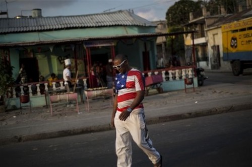 A Cuban man strolls through Santiago, Cuba, wearing clothing with American imagery. The Cuban populace has long harbored more pro-American viewpoints than mainstream media gives credit for. (AP Photo/Ramon Espinosa)