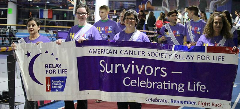 Cancer survivors lead the first lap at DePaul’s Relay for Life Friday. For 12 hours, students and family members walked the track to remember those that lost their lives to cancer, those that were still battling, and those who had survived. In total almost 400 participants raised more than $40,000 for the American Cancer Society for research and patient care.  (Megan Deppen / The DePaulia)