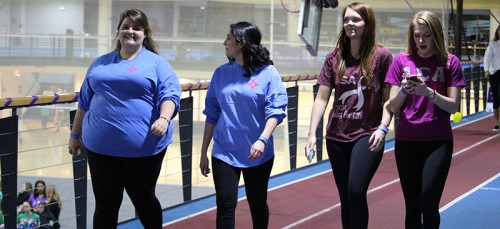 Kathleen Ashenden walk (L) with (L-R) Maria Paleologos, Kylen Schmitz and Christine Jeavons at Relay for Life and said everyone knows someone who has been affected by cancer.  Both Ashenden and Paleologos had friends who died from cancer. (Megan Deppen / The DePaulia)