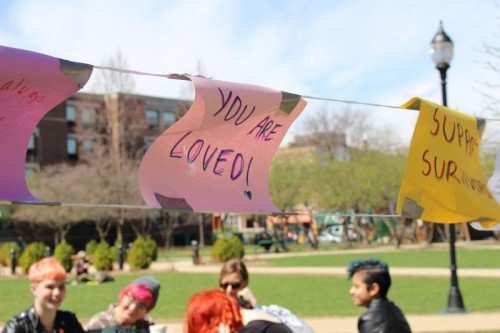 Positive messages hang in the quad to send sexual assault survivors hope and healing. The 2nd annual Carry the Weight event supported survivors on campuses around the U.S. (Megan Deppen / The DePaulia)