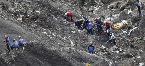 Rescue workers clear the Germanwings Flight 9525 crash site in the French Alps. Despite publicization of flight crashes, the probability of being in one remains near-nil. (AP Photo/Laurent Cipriani, File)
