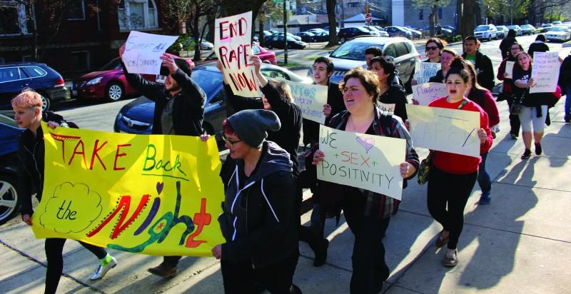 Protesters march Thursday evening in the annual Take Back the Night rally. (Erin Yarnall/The DePaulia)