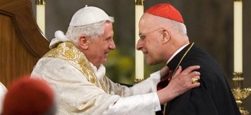 Pope Benedict XVI embraces Cardinal Francis George after addressing the bishops at the Basilica of the National Shrine of the Immaculate Conception in Washington. Cardinal Francis George, a vigorous defender of Roman Catholic orthodoxy who played a key role in the church’s response to the clergy sex abuse scandal, has died. (AP Photo/J. Scott Applewhite)