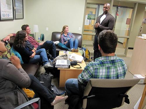 Rev. Keith Baltimore leads a discussion with students in the University Ministry Office on the third floor of the Lincoln Park Student Center. (Photo courtesy of University Ministry)