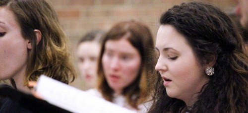 Christine Roberts practices during opera choral rehearsal April 15. Oftentime, voice students wait before beginning graduate school because the voice takes years to mature to its full potential. (Kirsten Onsgard / The DePaulia)