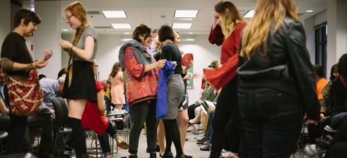 Students mingle at DePaul’s second annual Fair Trade Fashion Show on Friday. Local designers and brands promoted sustainable clothing and rights for sweatshop workers.  (Garrett Duncan / The DePaulia)