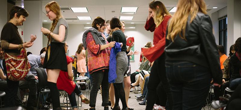 Students mingle at DePaul’s second annual Fair Trade Fashion Show on Friday. Local designers and brands promoted sustainable clothing and rights for sweatshop workers.  (Garrett Duncan / The DePaulia)
