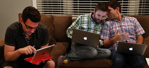 Frank Baiocchi, from left, Murphy Monroe and Jonathan Hoenig gather during their fantasy football draft picks at the home of one of their friends, in Deerfield, Illinois.  (Nuccio DiNuzzo/Chicago Tribune/MCT)
