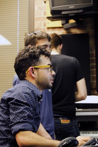 Zach Yanez and members of one of his bands, Just, mix a song that will be submitted to DePaul Activities Board’s Battle of the Bands competition. (Kirsten Onsgard / The DePaulia)