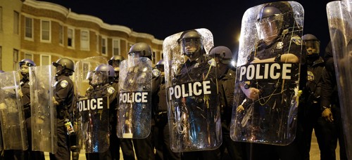 Police stood guard in Baltimore during the protests following the death of Freddie Gray in April. (AP Photo/Patrick Semansky, File)