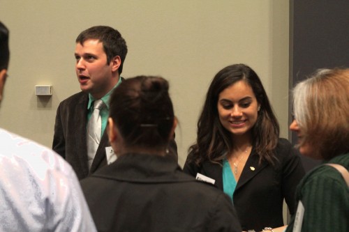 (L-R)  Joseph Prosnitz and Elizabeth Hakimi pitch their company, UpRide, to curious attendees at the DePaul Launch Awards,. The duo won both the $4,000 undergraduate first prize award and the $1,000 people's choice award to fund their business. (Megan Deppen / The DePaulia)