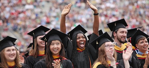 Graduates celebrate their degree at their commencement ceremony. (Amber Arnold/Wisconsin State Journal via AP)