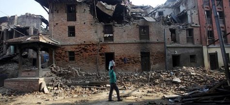 Alex Gaulin, center, with two Nepalese men during her trip to Kathmandu, Nepal in the days before the deadly earthquake April 25. Gaulin, a Chicago native, made it home to the U.S. safely, but the death toll from the quake has reached more than 7,000. (Photo courtesy of Tim Vollmer)