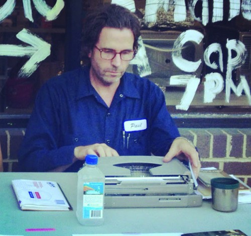  DePaul Professor Eric Plattner types poems as part of the Chicago Poetry Collective's  Poems While You Wait at the Buena Park Arts Expo in July 2013.  (Photo courtesy of Kathleen Rooney)