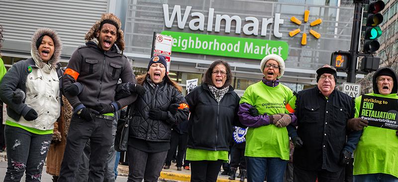Wal-Mart workers and supporters block Jefferson Street as they protest in front of Wal-Mart Neighborhood Market on Nov. 28 in the West Loop in Chicago. (Zbigniew Bzdak/Chicago Tribune/TNS)