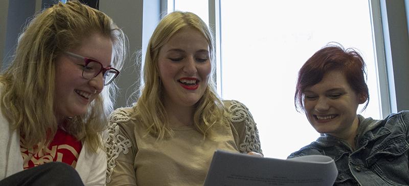 The Theatre School students Shea Corpora, Kaysie Bekkela and Emily Witt work together during a playwrighting class taught by Dean Corrin. (Geoff Stellfox / The DePaulia)
