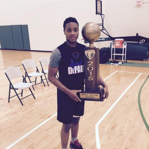 Curie point guard  Devin Gage holds the DePaul Team Camp MVP trophy. Gage committed to the Blue Demons on Friday.  (Photo courtesy of Twitter)