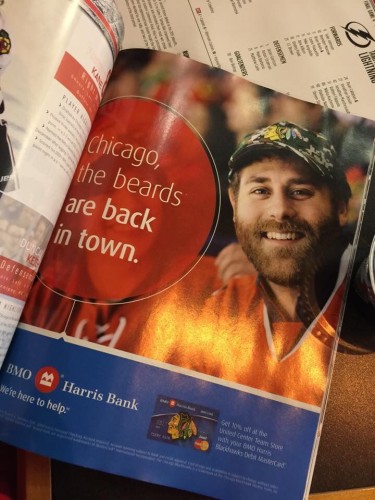 The official program of the Chicago Blackhawks has an advertisement with DePaul grad Jaeger Robertson and his beard. 