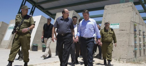 Israel Defense Forces (IDF) 91st Division Commander Moni Katz, left, Israeli Defense Minister Moshe Ya'alon, third from left, and U.S. Defense Secretary Ash Carter, second from right, walk from viewing Hula Valley from the Hussein Lookout, near Kiryat Shmona, Israel, Monday, July 20, 2015, in northern Israel along the boarder with Lebanon. Carter said he has no expectation of persuading Israeli leaders to drop their opposition to the Iran nuclear deal, but will instead emphasize that the accord imposes no limits on what Washington can do to ensure the security of Israel and U.S. Arab allies. (AP Photo/Carolyn Kaster, Pool)