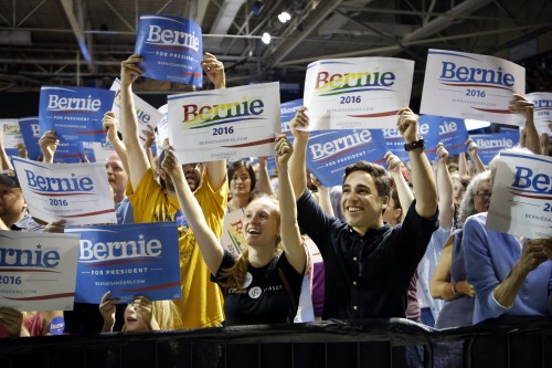 In this July 6, 2015, photo, supporters of Democratic presidential candidate Sen. Bernie Sanders, I-Vt., cheer at a campaign rally in Portland, Maine. Sanders is packing 'em in: 10,000 people in Madison, Wisconsin. More than 2,500 in Council Bluffs, Iowa. Another 7,500 this week in Portland. The trick for the independent senator from Vermont is to turn all that excitement into something more than a summer fling.(AP Photo/Robert F. Bukaty)