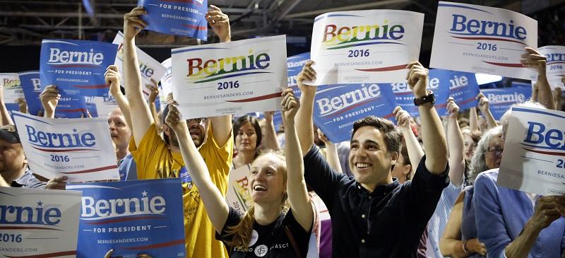 In this July 6, 2015, photo, supporters of Democratic presidential candidate Sen. Bernie Sanders, I-Vt., cheer at a campaign rally in Portland, Maine. Sanders is packing 'em in: 10,000 people in Madison, Wisconsin. More than 2,500 in Council Bluffs, Iowa. Another 7,500 this week in Portland. The trick for the independent senator from Vermont is to turn all that excitement into something more than a summer fling.(AP Photo/Robert F. Bukaty)