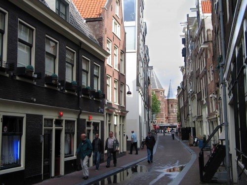 On the winding streets of Amsterdam's Red Light district, the red lights above the doors mean Amsterdam's prostitutes are open for business, legally. (Ellen Creager/Detroit Free Press/MCT)