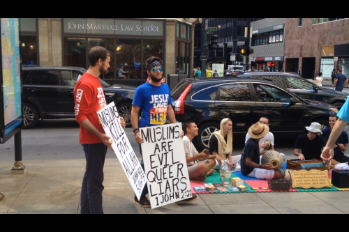 Two men who organized on an online Christian preaching website to protest what they said was a Muslim convention ended up speaking out against a group of Hare Krishnas outside the DePaul Center, Friday. 