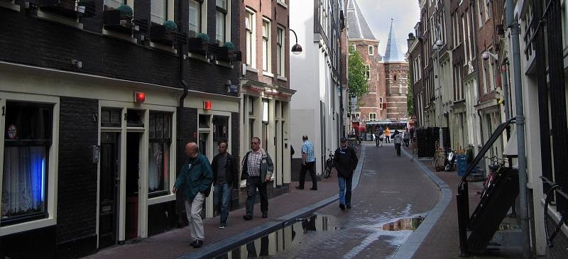 On the winding streets of Amsterdams Red Light district, the red lights above the doors mean Amsterdams prostitutes are open for business, legally. (Ellen Creager/Detroit Free Press/MCT)