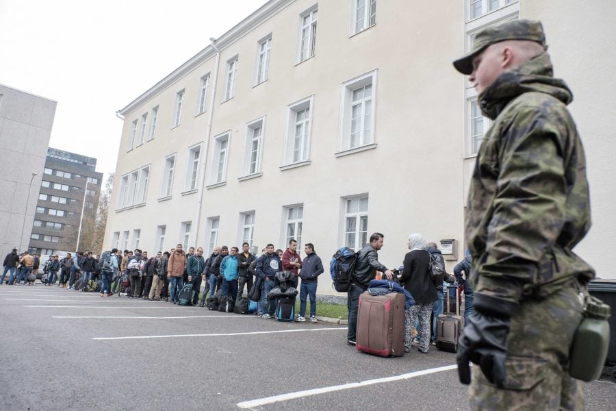 Asylum seekers queue up as they arrive at a refugee reception centre in the northern town of Tornio, Finland, on Friday Sept. 25, 2015. According to current official predictions, about 30,000 asylum seekers will arrive in Finland this year, compared to 3,651 last year. (Panu Pohjola/Lehtikuva via AP)  FINLAND OUT - NO SALES