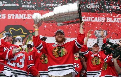 The Chicago Blackhawks' Patrick Kane raises the Stanley Cup during the championship celebration on Thursday, June 18, 2015, at Soldier Field in Chicago. (Brian Cassella/Chicago Tribune/TNS)
