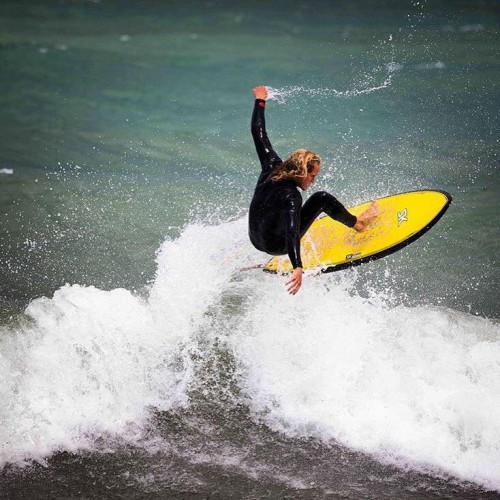 William Charles Rozier catches a wave on the coast of Lake Michigan. (Photo courtesy of Ian Jacobson.)