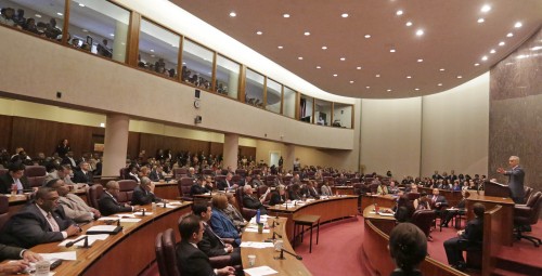 Mayor Rahm Emanuel outlines his 2016 proposed budget before the City Council, Tuesday, Sept. 22, 2015, in Chicago. In his speech Emanuel called for a phased-in $543 million property tax increase, along with $45 million more for schools. He also called for other fees, including for garbage collection and ride-sharing services. (AP Photo/M. Spencer Green)