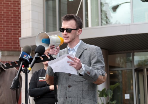 DePaul student and leader of Vincentians Against Torture Jack O’Brien leads the press conference Thursday morning calling for the university to strip Dr. Gerald Koocher of his deanship over the College of Science and Health. The group started an online petition against Koocher that has garnered more than 500 signatures. O’Brien said he is meeting with the new Provost Marten denBoer on the issue. (Megan Deppen / The DePaulia)