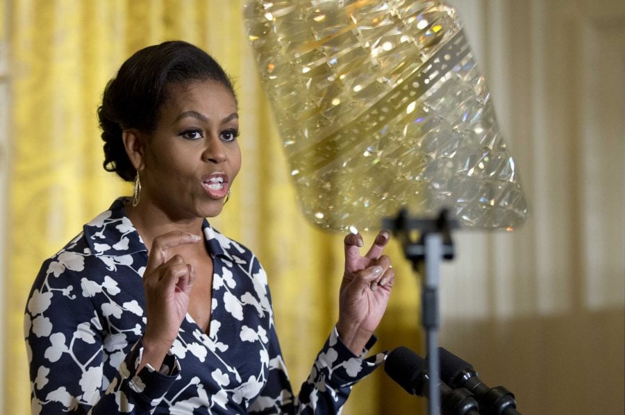 First lady Michelle Obama speaks in the East Room of the White House in Washington, Monday, Oct. 19, 2015, unveiling a new phase of her Reach Higher initiative encouraging students to continue education after high school, a public awareness campaign and matching website to provide practical information and space to share stories, backed by more than 20 media, business and nonprofit groups.  (AP Photo/Manuel Balce Ceneta)