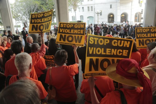 Activists for more gun control gather in front of Los Angeles City Hall for a rally prior to a vote by the Los Angeles City Council vote that would ban the possession of large capacity firearm magazines, on Tuesday, July 28, 2015. (Mark Boster/Los Angeles Times/TNS)