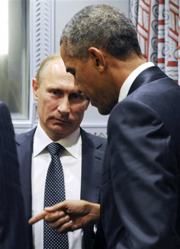 U.S. President Barack Obama, right, gestures while speaking to Russian President Vladimir Putin before a bilateral meeting at United Nations headquarters in New York, Monday, Sept. 28, 2015. (Mikhail Klimentyev, RIA-Novosti, Kremlin Pool Photo via AP)