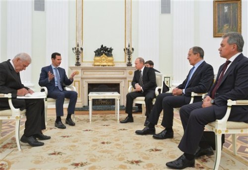 In this photo taken on Tuesday President Bashar Assad was in Moscow, in his first known trip abroad since the war broke out in Syria in 2011, to meet his strongest ally Russian leader Vladimir Putin. The two leaders stressed that the military operations in Syria — in which Moscow is the latest and most powerful addition — must lead to a political process.(Photo courtesy of Alexei Druzhinin, RIA-Novosti, Kremlin Pool | Associated Press.)