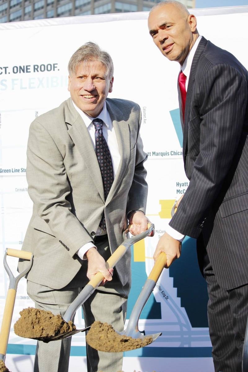 DePaul women's basketball coach Doug Bruno and men's basketball coach Dave Leitao break ground on the new arena Monday. (Kirsten Onsgard / The DePaulia)