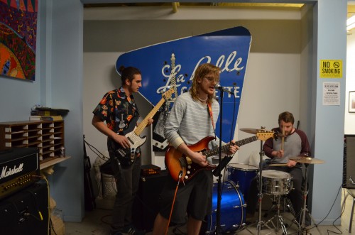 Forgotten Tropics, a blues band whose members attend DePaul, perform at a show at Art Colony, a venue and art studio in Avondale. (Photo by Megan Stringer | The DePaulia).