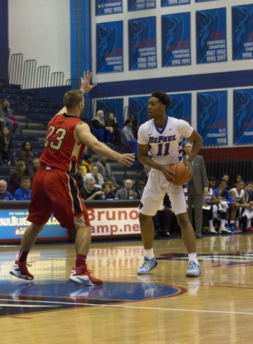 Freshman Eli Cain faces up a Caldwell defender. Cain scored seven points and had four assists as DePaul won its lone exhibition game Saturday 82-52. 