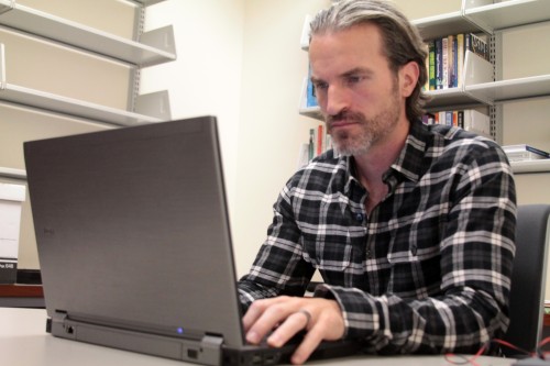 Billy Banks, the new executive director of the Coleman Entrepreneurship Center, sits in his office. Banks began last week, replacing Terri Lonier. (Megan Deppen / The DePaulia)